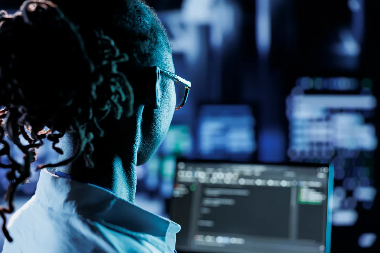 Developer reviewing code in a server facility